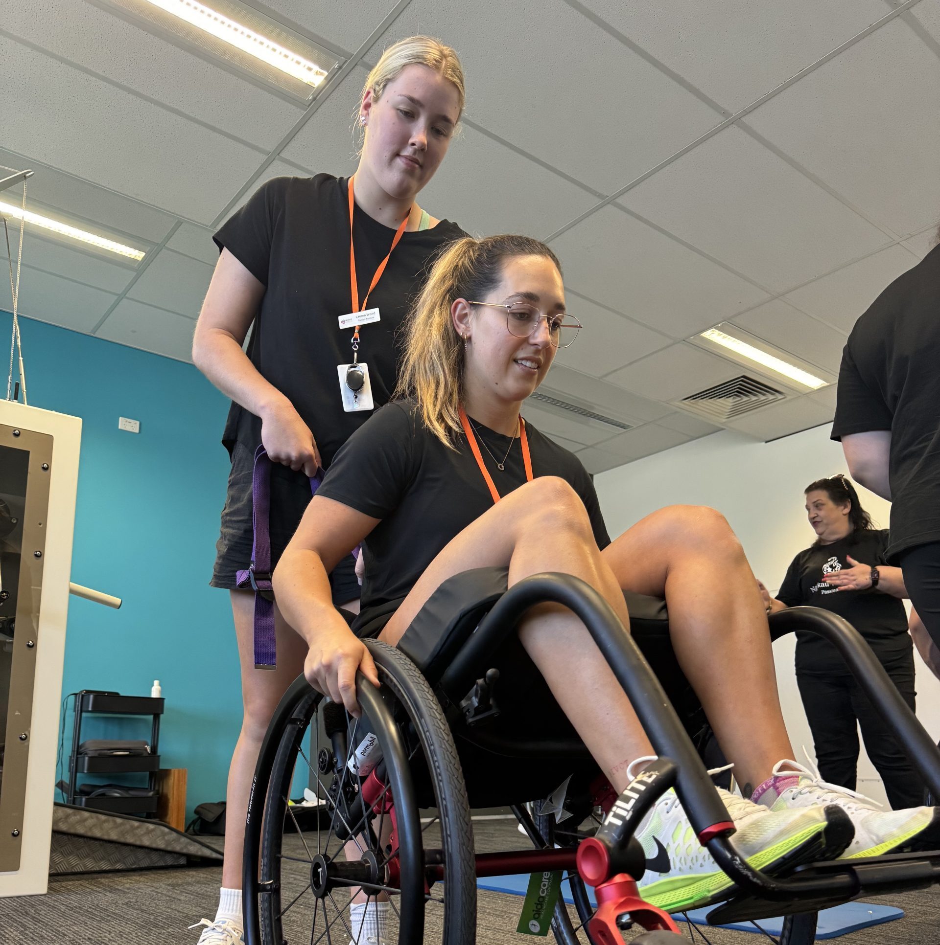 Physiotherapists practicing manual wheelchair skills